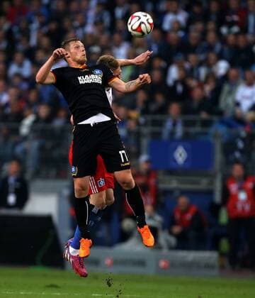 Hamburger SV - Karlsruher SC 1. Fussball Bundesliga Relegations-Hinspiel Saison 2014-2015 Hamburger SV - Karlsruher SC in der Imtech Arena Hamburg v.l.: Rouwen Hennings (Karlsruher SC), Slobodan Rajkovic (Hamburger SV)