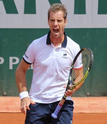 Richard Gasquet of France reacts after a shot during his French Open men s second round match against Carlos Berlocq of Argentina at Roland Garros in Paris on May 29, 2015. Gasquet defeated Berlocq 3-6, 6-3, 6-1, 4-6, 6-1 to advance to the next round.  PAR20150529712 DAVIDxSILPA