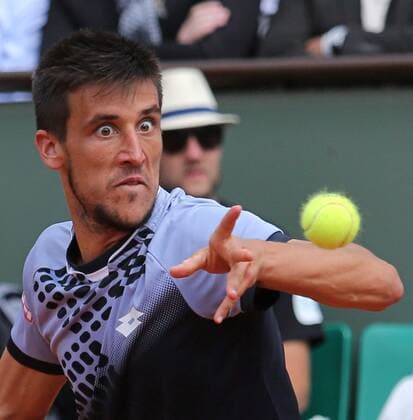 Damir Dzumhur of Bosnia and Herzegovina hits a shot during his French Open men s third round match against Roger Federer of Switzerland at Roland Garros in Paris on May 29, 2015. Federer defeated Dzumhur 6-4, 6-3, 6-2 to advance to the next round.  PAR20150529722 DAVIDxSILPA