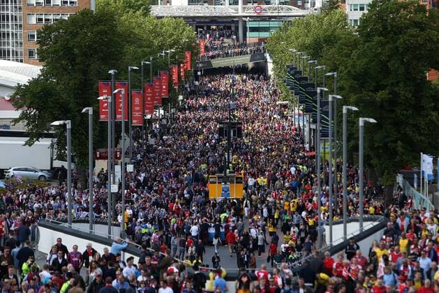 Fans arrive on Wembley Way - Arsenal vs. Aston Villa - FA Cup Final - Wembley Stadium - London - 30 05 2015 Pic Philip Oldham Sportimage EDITORIAL USE ONLY. No use with unauthorised audio, video, data, fixture lists, club league logos or live services. Online in-match use limited to 120 images, no video emulation. No use in betting, games or single club league player publications.