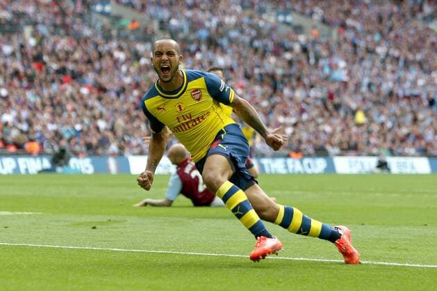 Arsenal s Theo Walcott celebrates his opening goal - Arsenal vs. Aston Villa - FA Cup Final - Wembley Stadium - London - 30 05 2015 Pic Philip Oldham Sportimage EDITORIAL USE ONLY. No use with unauthorised audio, video, data, fixture lists, club league logos or live services. Online in-match use limited to 120 images, no video emulation. No use in betting, games or single club league player publications.