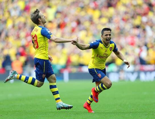 Arsenal s Alexis Sanchez celebrates scoring his sides second goal FA Cup Final - Arsenal vs Aston Villa - Wembley Stadium - England - 30th May 2015 - Picture David Klein Sportimage EDITORIAL USE ONLY. No use with unauthorised audio, video, data, fixture lists, club league logos or live services. Online in-match use limited to 120 images, no video emulation. No use in betting, games or single club league player publications.