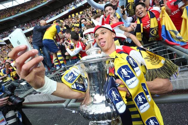 Arsenal s Kieran Gibbs poses for a selfie with the FA Cup - Arsenal vs. Aston Villa - FA Cup Final - Wembley Stadium - London - 30 05 2015 Pic Philip Oldham Sportimage EDITORIAL USE ONLY. No use with unauthorised audio, video, data, fixture lists, club league logos or live services. Online in-match use limited to 120 images, no video emulation. No use in betting, games or single club league player publications.