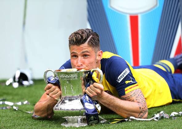 Arsenal s Olivier Giroud celebrates with the trophy FA Cup Final - Arsenal vs Aston Villa - Wembley Stadium - England - 30th May 2015 - Picture David Klein Sportimage EDITORIAL USE ONLY. No use with unauthorised audio, video, data, fixture lists, club league logos or live services. Online in-match use limited to 120 images, no video emulation. No use in betting, games or single club league player publications.