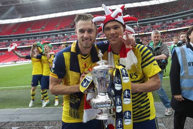 Aaron Ramsey and Arsenal s Kieran Gibbs with the FA Cup - Arsenal vs. Aston Villa - FA Cup Final - Wembley Stadium - London - 30 05 2015 Pic Philip Oldham Sportimage EDITORIAL USE ONLY. No use with unauthorised audio, video, data, fixture lists, club league logos or live services. Online in-match use limited to 120 images, no video emulation. No use in betting, games or single club league player publications.