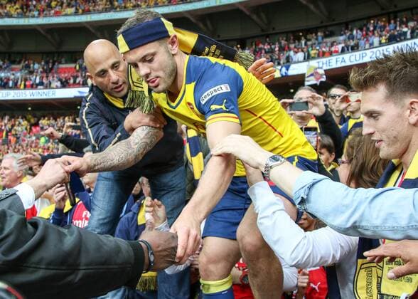 Football - 2015 FA Cup Final - Arsenal vs. Aston Villa. Arsenal s Jack Wilshere emerges from the crowd after he lept in amongst them at Wembley Stadium COLORSPORT DANIEL BEARHAM  AST_ARS