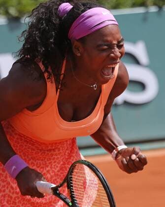 American Serena Williams reacts after a shot during her French Open women s quarterfinal match against Sara Errani of Italy at Roland Garros in Paris on June 3, 2015. Williams defeated Errani 6-1, 6-3 to advance to the next round.  PAR20150603713 DAVIDxSILPA