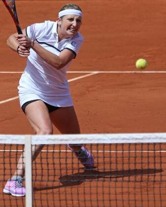 Timea Bacsinszky of Switzerland hits a shot during her French Open women s quarterfinal match against Alison Van Uytvanck of Belgium at Roland Garros in Paris on June 3, 2015. Bacsinszky defeated Van Uytvanck 6-4, 7-5 to advance to the next round.  PAR20150603716 DAVIDxSILPA