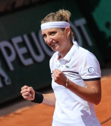 Timea Bacsinszky of Switzerland reacts after winning her French Open women s quarterfinal match against Alison Van Uytvanck of Belgium at Roland Garros in Paris on June 3, 2015. Bacsinszky defeated Van Uytvanck 6-4, 7-5 to advance to the next round.  PAR20150603730 DAVIDxSILPA