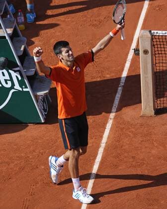 Novak Djokovic of Serbia reacts after winning his French Open men s quarterfinal match against Rafael Nadal of Spain at Roland Garros in Paris on June 3, 2015. Djokovic defeated Nadal 7-5, 6-3, 6-1 to advance to the next round.  PAR20150603732 DAVIDxSILPA