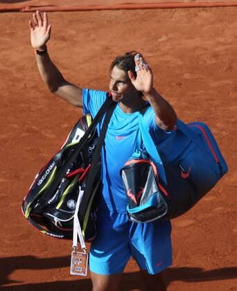 Rafael Nadal of Spain acknowledges the crowd after losing his French Open men s quarterfinal match against Novak Djokovic of Serbia at Roland Garros in Paris on June 3, 2015. Djokovic defeated Nadal 7-5, 6-3, 6-1 to advance to the next round.  PAR20150603733 DAVIDxSILPA