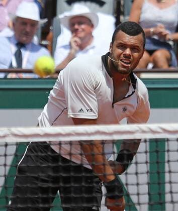 Jo-Wilfried Tsonga of France hits a shot during his French Open men s semifinal match against Stan Wawrinka of Switzerland at Roland Garros in Paris on June 5, 2015.  PAR20150605702 DAVIDxSILPA