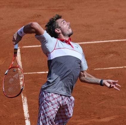 Stan Wawrinka of Switzerland hits a serve during his French Open men s semifinal match against Jo-Wilfried Tsonga of France at Roland Garros in Paris on June 5, 2015.  PAR20150605726 DAVIDxSILPA
