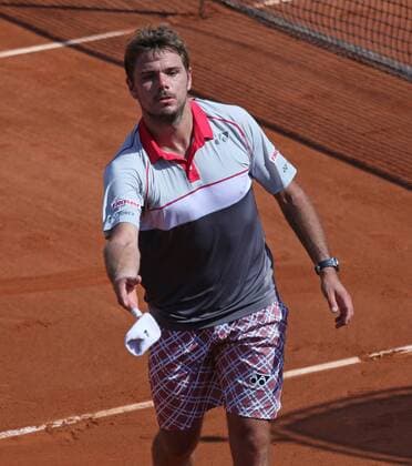 Stan Wawrinka of Switzerland throws his sweatband into the crowd after winning his French Open men s semifinal match against Jo-Wilfried Tsonga of France at Roland Garros in Paris on June 5, 2015. Wawrinka defeated Tsonga 6-3, 6-7 (1), 7-6 (3), 6-4 to advance to the final round.  PAR20150605732 DAVIDxSILPA