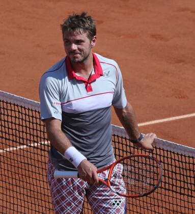 Stan Wawrinka of Switzerland reacts after winning his French Open men s semifinal match against Jo-Wilfried Tsonga of France at Roland Garros in Paris on June 5, 2015. Wawrinka defeated Tsonga 6-3, 6-7 (1), 7-6 (3), 6-4 to advance to the final round.  PAR20150605729 DAVIDxSILPA