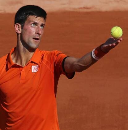 Novak Djokovic of Serbia hits a serve during his French Open men s semifinal match against Andy Murray of Great Britain at Roland Garros in Paris on June 5, 2015.  PAR20150605739 DAVIDxSILPA