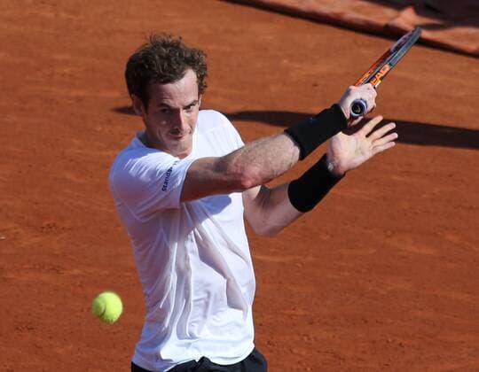 Andy Murray of Great Britain hits a shot during his French Open men s semifinal match against Novak Djokovic of Serbia at Roland Garros in Paris on June 5, 2015.  PAR20150605740 DAVIDxSILPA