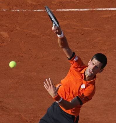 Novak Djokovic of Serbia hits a smash during his French Open men s semifinal match against Andy Murray of Great Britain at Roland Garros in Paris on June 5, 2015.  PAR20150605747 DAVIDxSILPA