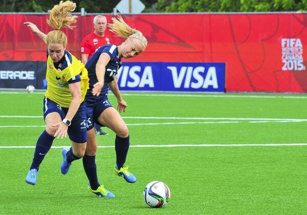 June 5, 2015 - Ottawa, Ontario, Canada - June 05, 2015: Team Norway players battle for the ball as coach Even Pellerud watches on during the Norway team training session at Algonquin College in Ottawa, Canada prior to the start of the FIFA 2015 Women s World Cup. Soccer: FIFA 2015 Women s World Cup - Norway Training Session. - ZUMAk120