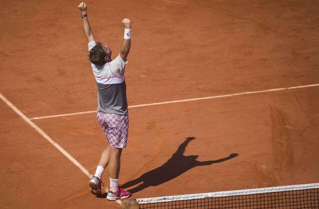 Stan Wawrinka of Switzerland celebrates after winning the men s singles semifinal against Jo-Wilfried Tsonga of France at 2015 French Open tennis tournament at Roland Garros in Paris June 5, 2015. Wawrinka won 3-1 and advanced to the final. ) (SP)FRANCE-PARIS-TENNIS-FRENCH OPEN ChenxXiaowei 