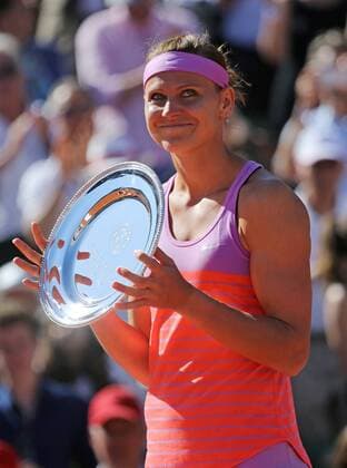 Lucie Safarova of the Czech Republic holds the runners-up trophy after losing her French Open women s final match against American Serena Williams at Roland Garros in Paris on June 6, 2015. Williams defeated Safarova 6-3, 6-7 (2), 6-2 to win her third French Open title.  PAR20150606728 DAVIDxSILPA