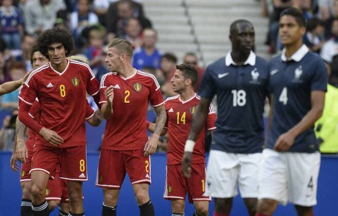 - PARIS, FRANCE: Belgium s Marouane Fellaini (L) celebrates with his teammates after scoring during a friendly game between France and Belgium in the Stade de France in Paris, France, Sunday 07 June 2015. The Devils are preparing for a Euro 2016 qualification game against Wales on Friday. DIRKxWAEM  x04637899x