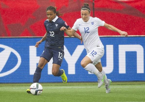 (150609) -- MONCTON, June 9, 2015 -- Lucy Bronze(R) of England vies with Elodie Thomis of France during their group F match at the 2015 FIFA Women s World Cup in Moncton, Canada, June 9, 2015. France won 1-0. ) (SP)CANADA-MONCTON-FIFA WOMEN S WORLD CUP-GROUP F-FRANCE VS ENGLAND ZouxZheng 