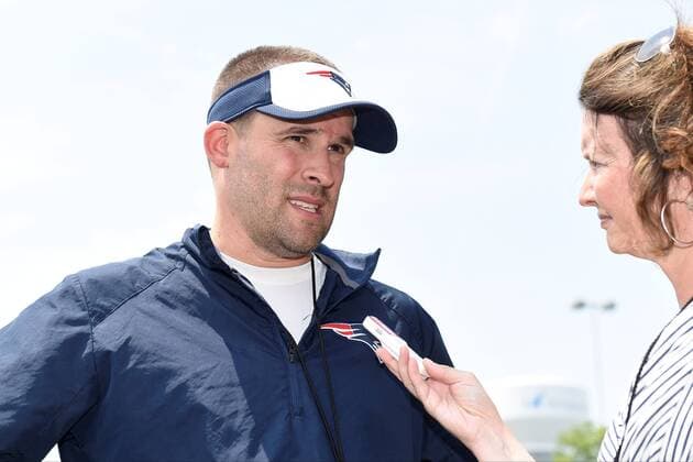 June 11, 2015 - Foxborough, Massachusetts, U.S. - New England Patriots offensive coordinator Josh McDaniels is interviewed by a reporter at the organized team activities held on the practice fields at Gillette Stadium in Foxborough Massachusetts. Eric Canha CSM NFL American Football Herren USA 2015: Patriots OTA JUN 11 - ZUMAc04_
