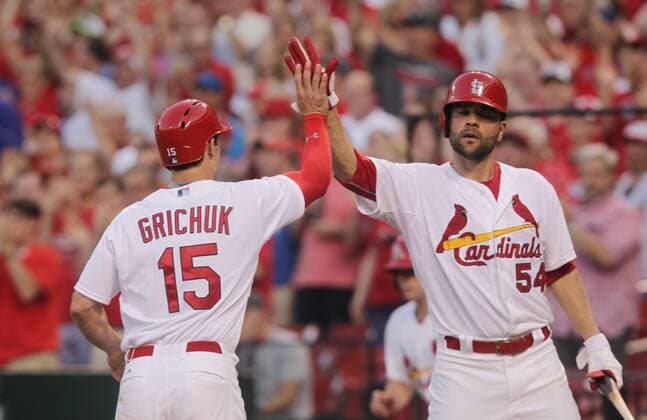 St. Cardinals Randal Grichuk slaps hands with Jaime Garcia after scoring on a triple by Jon Jay in the second inning against the Kansas City Royals at Busch Stadium in St. Louis on June 12, 2015.  SLP2015061206 BILLxGREENBLATT