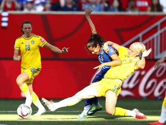 (150613) -- WINNIPEG, June 12, 2015 -- Christen Press (C) of the United States vies Nilla Fischer (R) of Sweden during their Group D match at Winnipeg Stadium in Winnipeg, Canada on June 12, 2015. ) (SP)CANADA-WINNIPEG-FIFA-WOMEN S WORLD CUP-USA VS SWE DingxXu 