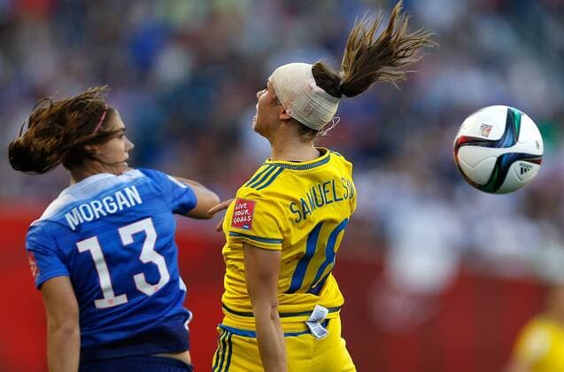 (150613) -- WINNIPEG, June 12, 2015 -- Alex Morgan (L) of the United States vies with Jessica Samuelsson of Sweden during their Group D match at Winnipeg Stadium in Winnipeg, Canada on June 12, 2015. The match ended 0-0. ) (SP)CANADA-WINNIPEG-FIFA-WOMEN S WORLD CUP-USA VS SWE WangxLili 