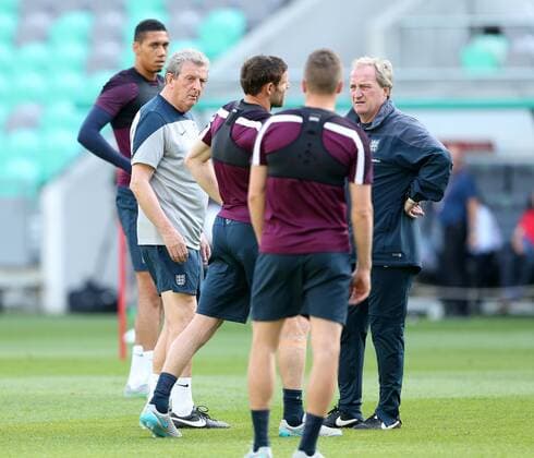 England s James Milner grimmaces after he feels a pull during training as Roy Hodgson looks on England Training & press conference PK Pressekonferenz Stozice Stadium - Slovenia - 13th June 2015 - Picture David Klein Sportimage EDITORIAL USE ONLY. No use with unauthorised audio, video, data, fixture lists, club league logos or live services. Online in-match use limited to 120 images, no video emulation. No use in betting, games or single club league player publications.