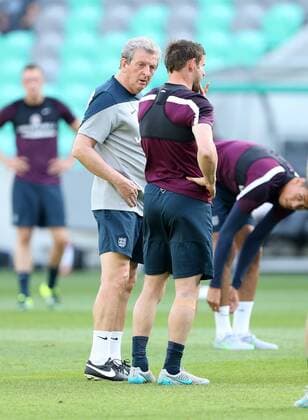 England s James Milner grimmaces after he feels a pull during training as Roy Hodgson looks on England Training & press conference PK Pressekonferenz Stozice Stadium - Slovenia - 13th June 2015 - Picture David Klein Sportimage EDITORIAL USE ONLY. No use with unauthorised audio, video, data, fixture lists, club league logos or live services. Online in-match use limited to 120 images, no video emulation. No use in betting, games or single club league player publications.