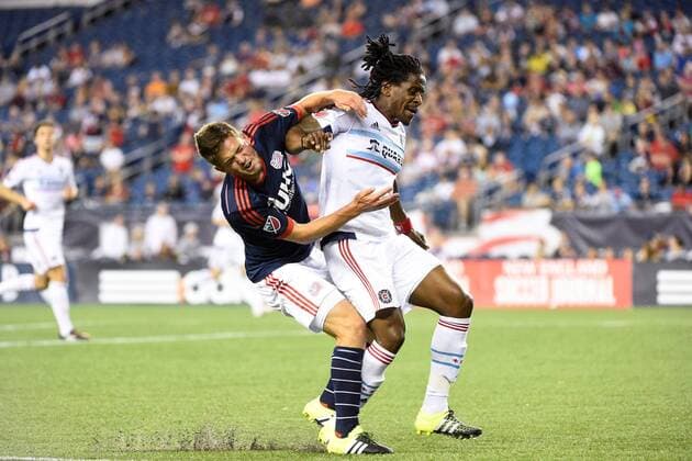 June 13, 2015 - Foxborough, Massachusetts, U.S. - New England Revolution midfielder Kelyn Rowe (11) (left) and Chicago Fire defender Lovel Palmer (5) (right) battle on the pitch during the MLS Fussball Herren USA game between Chicago Fire and the New England Revolution held at Gillette Stadium in Foxborough Massachusetts. The Revolution defeated the Fire 2-0. Eric Canha CSM MLS 2015: Fire vs Revolution JUN 13 - ZUMAc04_