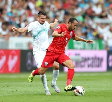 Slovenia s Andraz Kirm tussles with England s Andros Townsend Slovenia v England - World Cup 2018 Qualifier- Stozice Stadium - Slovenia - 14th June 2015 - Picture David Klein Sportimage EDITORIAL USE ONLY. No use with unauthorised audio, video, data, fixture lists, club league logos or live services. Online in-match use limited to 120 images, no video emulation. No use in betting, games or single club league player publications.