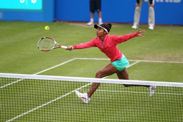 14.06.2015. Nottingham, England. Aegon Open Tennis. Forehand volley from Raquel Kops-Jones against Jocelyn Rae (GBR) and her partner Anna Smith xDavidxKissmanx  ActionPlus11631597