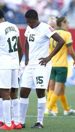 (150615) -- WINNIPEG, June 15, 2015 -- Photo taken on June 12, 2015 shows Nigeria s Ugo Njoku (R) reacting after the Group D match between Australia and Nigeria in Winnipeg, Canada. (SP)CANADA-WINNIPEG-FIFA WOMEN S WORLD CUP-NIGERIA-UGO NJOKU-BAN DingxXu 