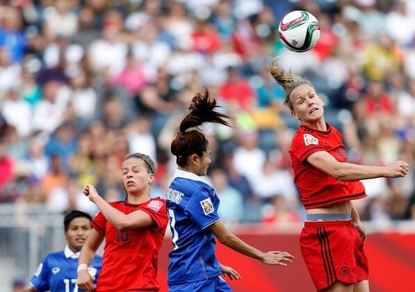 (150616) -- WINNIPEG, June, 2015 -- Melanie Leupolz (1st R) of Germany heads the ball during the Group B match between Germany and Thailand at the 2015 FIFA Women s World Cup in Winnipeg, Canada, June 15, 2015. Germany won 4-0. ) (SP)CANADA-WINNIPEG-FIFA WOMEN S WORLD CUP-GROUP B-GER VS THA WangxLili 