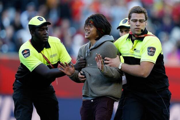 WINNIPEG, June 15, 2015 -- An intruder is expelled during the Group A match between China and New Zealand at the Winnipeg Stadium in Winnipeg, Canada, on June 15, 2015. The match ended with a 2-2 draw. China advanced to the round of 16. ) (SP)CANADA-WINNIPEG-FIFA WOMEN S WORLD CUP-CHN VS NZL WangxLili 