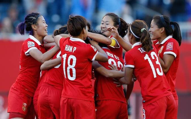 WINNIPEG, June 15, 2015 -- Players of China celebrate for score during the Group A match between China and New Zealand at the Winnipeg Stadium in Winnipeg, Canada, on June 15, 2015. The match ended with a 2-2 draw. China advanced to the round of 16. ) (SP)CANADA-WINNIPEG-FIFA WOMEN S WORLD CUP-CHN VS NZL WangxLili 