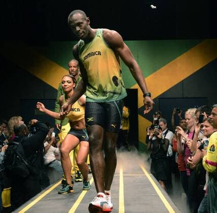 LONDON, Britain - Jamaican sprinter Usain Bolt (C front), three-time Olympic gold medalist and world record holder in the 100 meters, wears his country s kit for the upcoming London Olympics during an event in London on June 1, 2012.  0602012