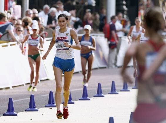 LONDON, Britain - Russia s Elena Lashmanova competes in the women s 20-kilometer race walk at the 2012 London Olympics on The Mall on Aug. 11, 2012. Lashmanova won the gold with a world record time of 1 hour, 25 minutes, 2 seconds.  0812027