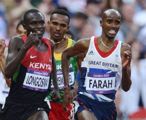 LONDON, Britain - Britain s Mo Farah (R) competes in the men s 5,000-meter final at the London 2012 Olympics at the Olympic Stadium in London on Aug. 11, 2012. Farah won the gold with a time of 13 minutes, 41.66 seconds.  0812043