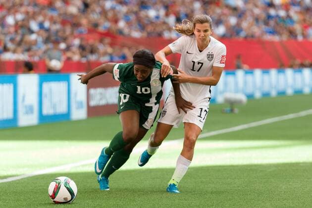 June 16, 2015: Courtney DIKE of Nigeria and Tobin HEATH of the USA fight for the ball during a Group D match at the FIFA Women s World Cup Canada 2015 between Nigeria and the USA at BC Place Stadium on 16 June 2015 in Vancouver, Canada. USA won 1-0. Sydney Low Cal Media. Soccer 2015: FIFA Women s World Cup JUNE 16 - ZUMAc04_