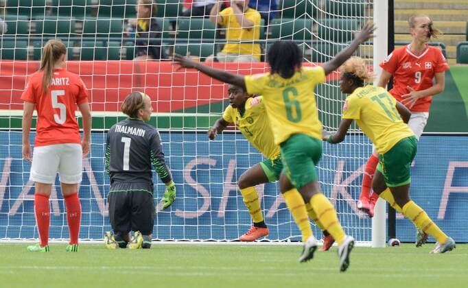 16 JUNE 2015: Cameroon s Madeleine Ngono (9) celebrates with her team after scoring the second goal of the game as Swiss goalkeeper Hedvig Lindahl (1) looks on at the FIFA Womens World Cup at Commonwealth Stadium in Edmonton, Alberta, Canada. SOCCER: JUN 16 FIFA Women s World Cup - Group C - Switzerland v Cameroon Icon20150611011 EDITORIAL USE ONLY
