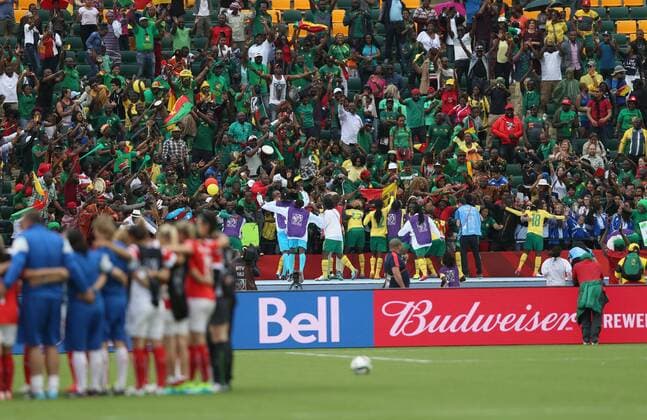 EDMONTON, June 16, 2015 -- Players of Cameroon celebrate with fans after winning the group C match against Switzerland at the 2015 FIFA Women s World Cup in Edmonton, Canada, June 16, 2015. Cameroon won 2-1 and was qualified for the round of 16. ) (SP)CANADA-EDMONTON-FIFA WOMEN S WORLD CUP-GROUP A-SWITZERLAND VS CAMEROON QinxLang 