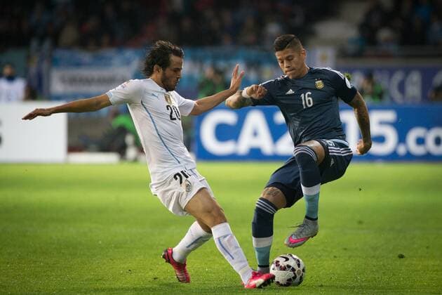 LA SERENA, June 16, 2015 -- Marcos Rojo (R) of Argentina vies with Alvaro Gonzalez of Uruguay during their Group B match at the 2015 American Cup, at La Portada stadium, in La Serena, Chile, on June 16, 2015. Argentina won 1-0. ) (ce) (SP)CHILE-LA SERENA-COPA AMERICA-ARGENTINA VS URUGUAY PedroxMera 