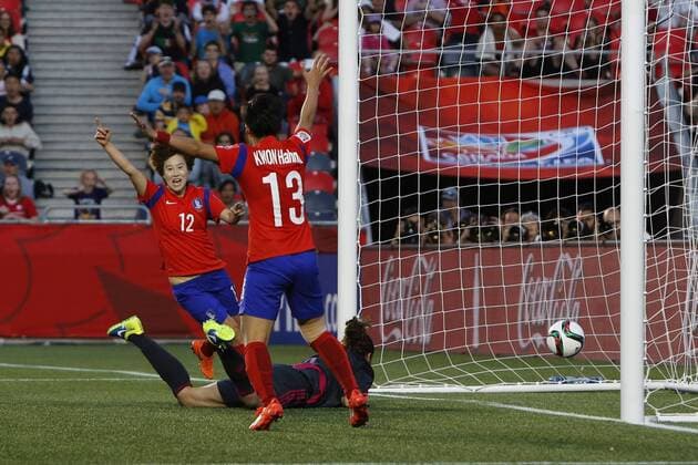 OTTAWA, June 17, 2015 -- South Korean players Yoo Younga and Kwon Hahnul celebrate their team s 2nd goal, scored by Kim Sooyun, in the FIFA Women s World Cup Group F match between South Korea and Spain at Lansdowne Stadium in Ottawa, Canada on June 17, 2015. South Korea beat Spain 2-1, allowing them to advance to the next round. ) (SP)CANADA-OTTAWA-FIFA WOMEN S WORLD CUP-SOUTH KOREA VS SPAIN DavidxKawai 