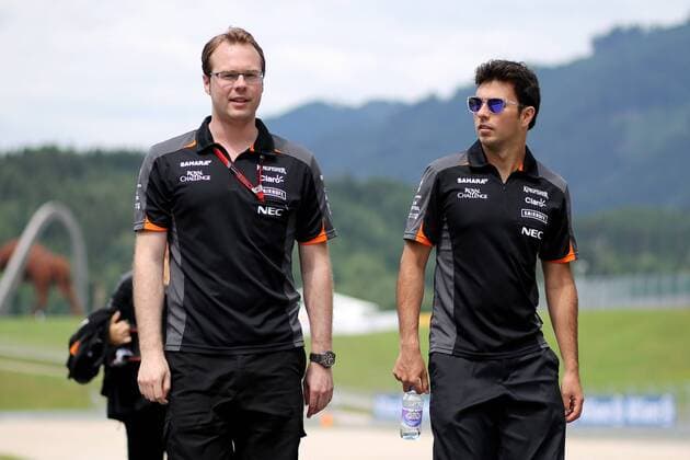 FORMULA 1 - GP of Austria 2015 SPIELBERG,AUSTRIA,18.JUN.15 - MOTORSPORTS, FORMULA 1 - Grand Prix of Austria, Red Bull Ring, preview. Image shows Sergio Perez (MEX Force India) and a team member. GEPAxpictures xDanielxGoetzhaber