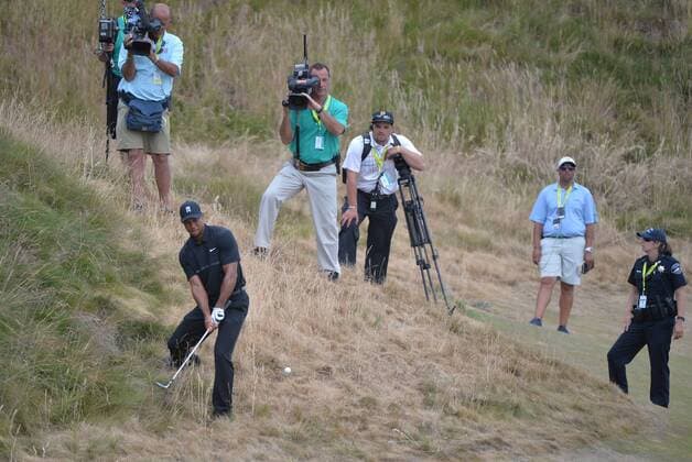 Tiger Woods hits out of the rough on the first hole of round one of the 115th U.S. Open Championship at Chambers Bay on June 18, 2015 in University Place, Washington.  SEA20150618292 KEVINxDIETSCH